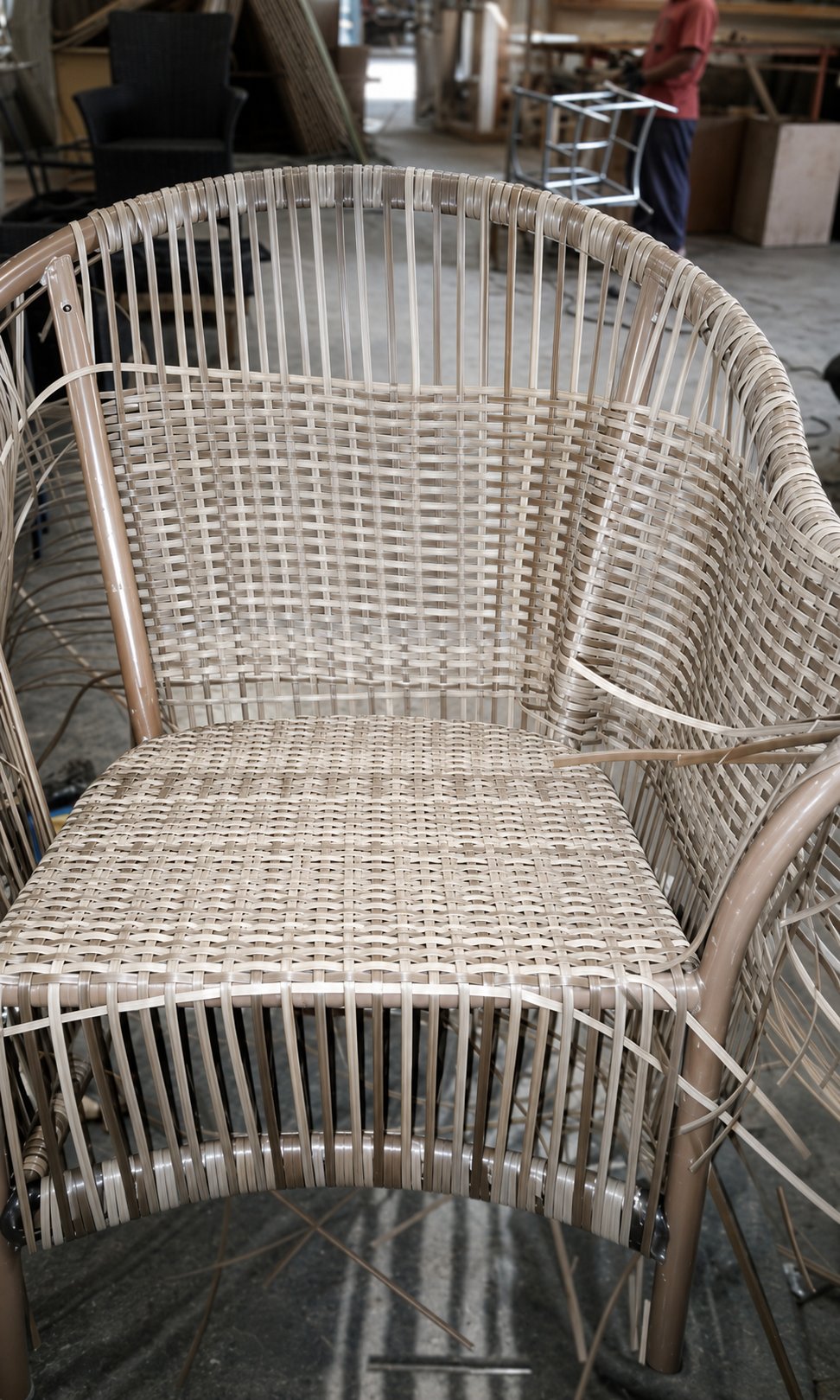 Close-up of an armchair's REHAU® Raucord weave taking shape