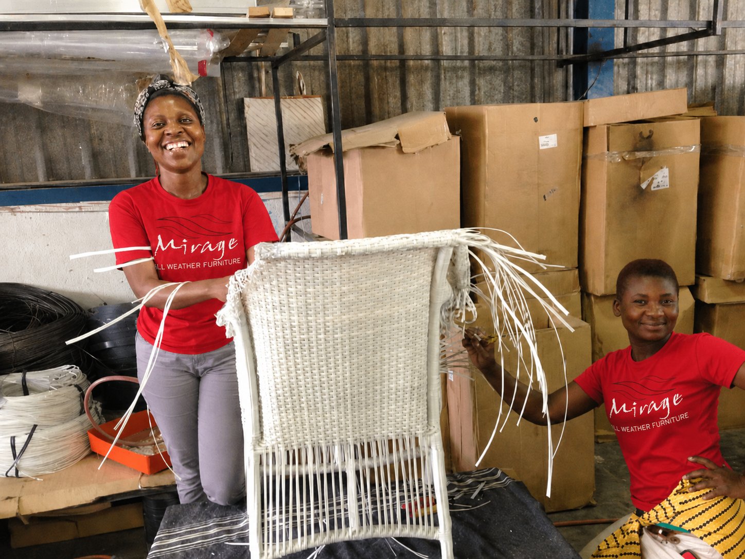 Two Mirage artisans hand-weaving a chair frame with REHAU® Raucord weave in the White River workshop