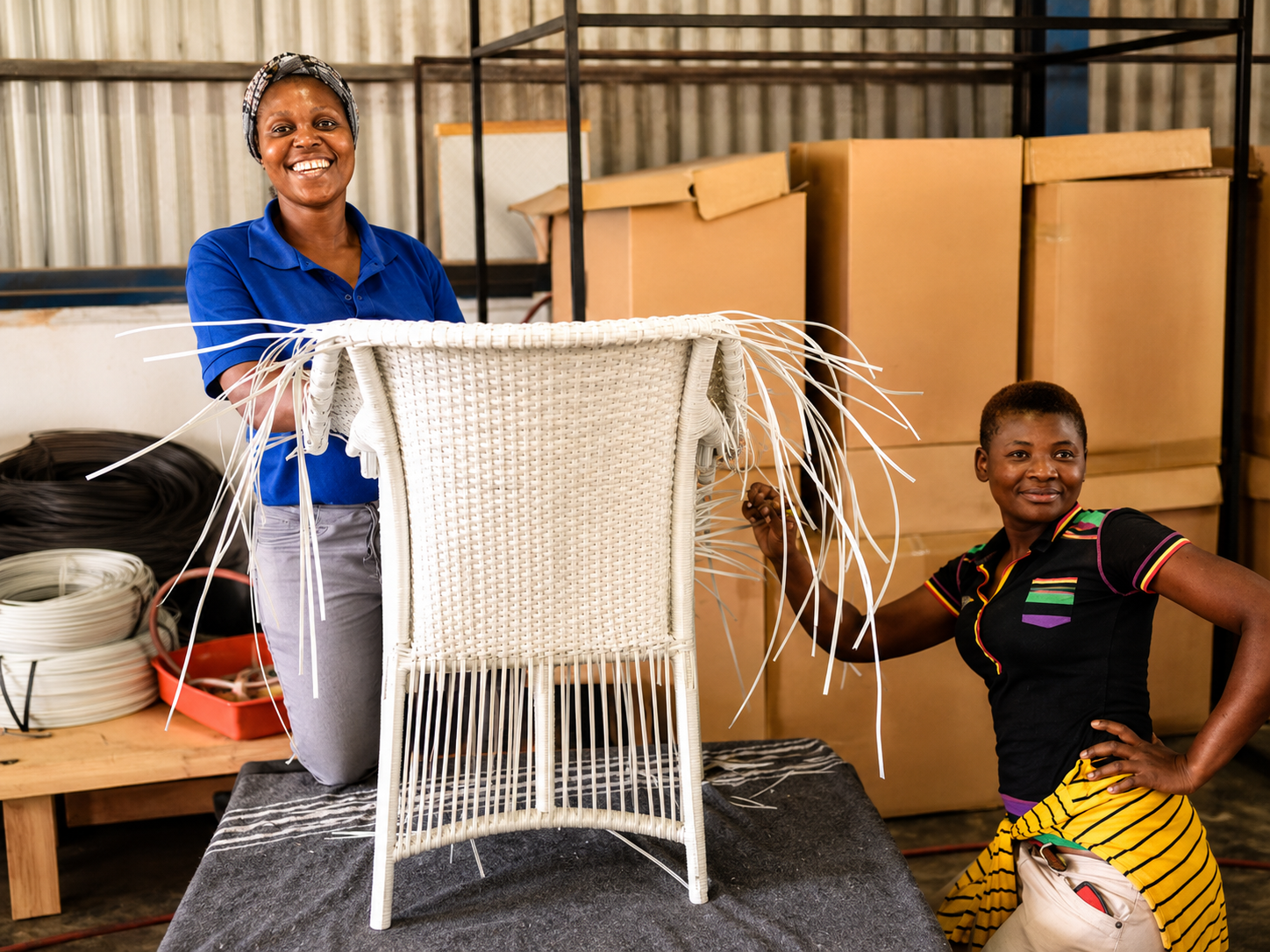 Two artisans hand-weaving a chair with REHAU® Raucord weave